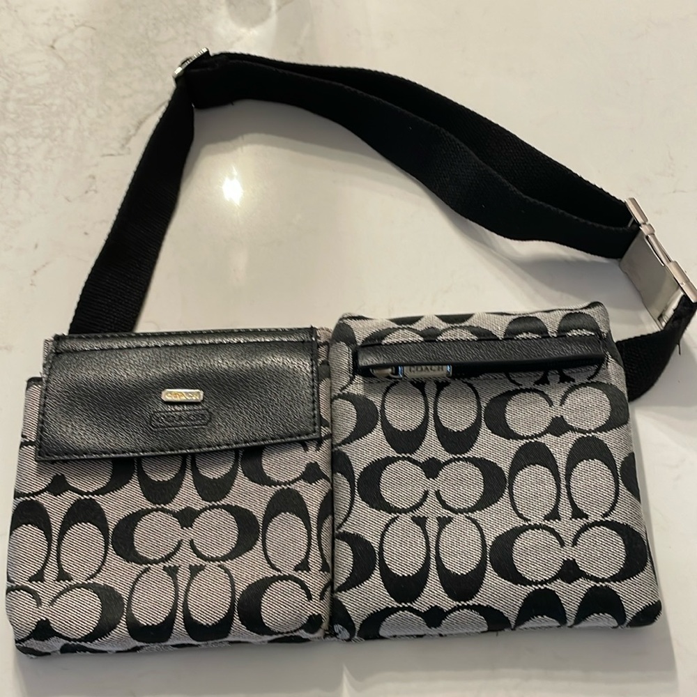 90. Coach Monogram waist belt